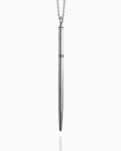 A sterling silver wand necklace hanging against a white background. This wand has a tapered square shape and is completely smooth except for three carved horizontal lines to delineate the wand handle.